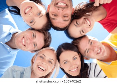 Summer, Holidays, Vacation, Happy People Concept - Group Of Teenagers Looking Down