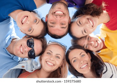 Summer, Holidays, Vacation, Happy People Concept - Group Of Teenagers Looking Down