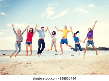 Summer, Holidays, Vacation, Happy People Concept - Group Of Friends Jumping On The Beach