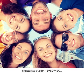 Summer, Holidays, Vacation, Happy People Concept - Group Of Teenagers Looking Down