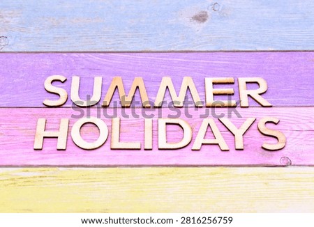 summer holidays write on rustical wooden background 