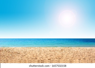 Summer Hot Sand On Beach. Ocean Landscape With Blue Sky. Sunny Day And Sun Light.