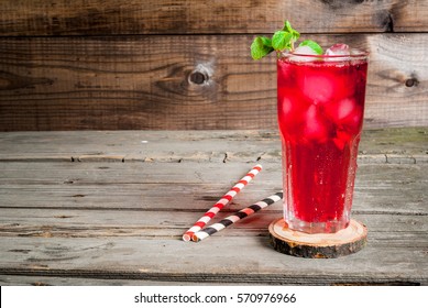 Summer iced drink - tea or juice with ice and mint. On rustic wooden table, copy space, horizontal - Powered by Shutterstock