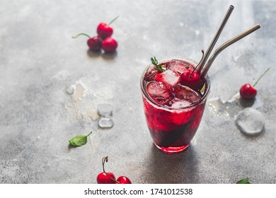 Summer Iced Refreshment Drink, Cherry Juice With Ice Cubes In The Glass. Vitamin C Concept. Hard Light