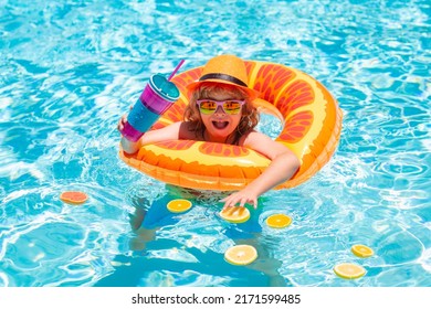 Summer Kids Cocktail. Happy Little Boy With Colorful Inflatable Ring In Outdoor Swimming Pool On Summer Day. Little Child Boy In Swimming Pool With Inflatable Toy Ring.