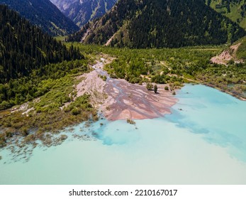 Summer landscape of the alpine lake Issyk near the city of Almaty. Beautiful view of the lake in the mountains. - Shutterstock ID 2210167017