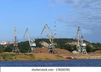 Summer Landscape Cranes On The River Sand Mining In The Port