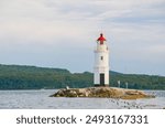 A summer landscape featuring Tokarevsky Lighthouse in Vladivostok, Russia