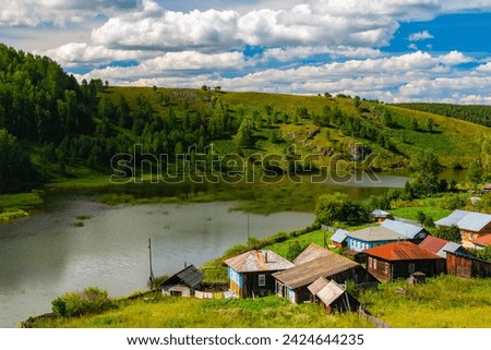 summer landscape on the banks of the green river at sunset, Russia, Ural