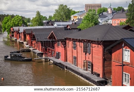Summer landscape of Porvoo town, Finland. Old red wooden houses and barns