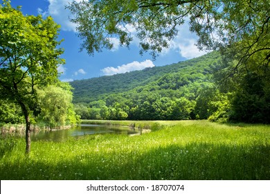 Summer Landscape With River And Blue Sky