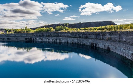 Summer Landscape Scene Featuring The Marmoraton Mine Blue Hole Lake In Marmora Ontario Canada, Paleozoic Sherman Fall Thin Medium Bedded Of Crystal Line Limestone With Interbedded Grey-green Shale 