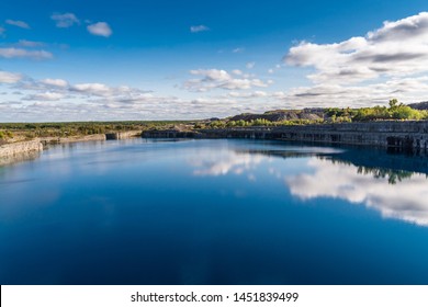 Summer Landscape Scene Featuring The Marmoraton Mine Blue Hole Lake In Marmora Ontario Canada, Paleozoic Sherman Fall Thin Medium Bedded Of Crystal Line Limestone With Interbedded Grey-green Shale 