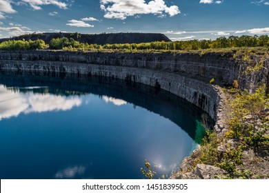 Summer Landscape Scene Featuring The Marmoraton Mine Blue Hole Lake In Marmora Ontario Canada, Paleozoic Sherman Fall Thin Medium Bedded Of Crystal Line Limestone With Interbedded Grey-green Shale 