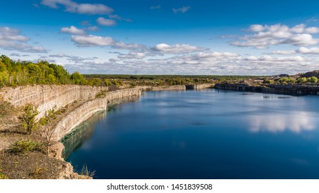 Summer Landscape Scene Featuring The Marmoraton Mine Blue Hole Lake In Marmora Ontario Canada, Paleozoic Sherman Fall Thin Medium Bedded Of Crystal Line Limestone With Interbedded Grey-green Shale 