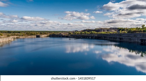 Summer Landscape Scene Featuring The Marmoraton Mine Blue Hole Lake In Marmora Ontario Canada, Paleozoic Sherman Fall Thin Medium Bedded Of Crystal Line Limestone With Interbedded Grey-green Shale 