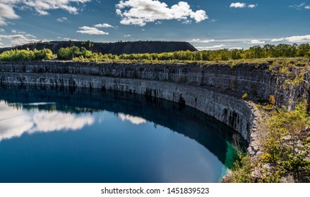 Summer Landscape Scene Featuring The Marmoraton Mine Blue Hole Lake In Marmora Ontario Canada, Paleozoic Sherman Fall Thin Medium Bedded Of Crystal Line Limestone With Interbedded Grey-green Shale 