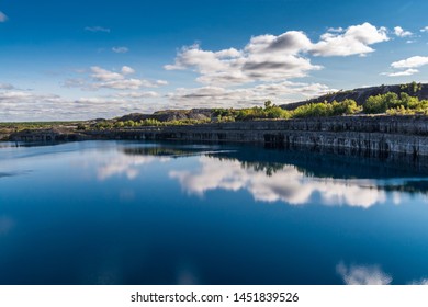 Summer Landscape Scene Featuring The Marmoraton Mine Blue Hole Lake In Marmora Ontario Canada, Paleozoic Sherman Fall Thin Medium Bedded Of Crystal Line Limestone With Interbedded Grey-green Shale 