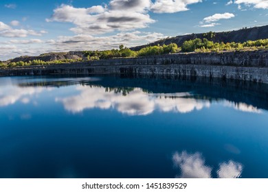 Summer Landscape Scene Featuring The Marmoraton Mine Blue Hole Lake In Marmora Ontario Canada, Paleozoic Sherman Fall Thin Medium Bedded Of Crystal Line Limestone With Interbedded Grey-green Shale 