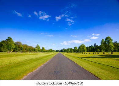 Summer Landscape With Straight One Lane Country Road In Southern England UK