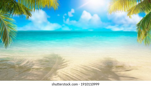 Summer landscape of tropical island. Branches of palm trees create shade in sand. Dazzlingly bright sun. Horizon is sof blurred. Transition of sandy beach to turquoise water.