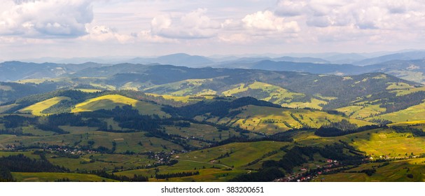 summer landscape. village on the hillside. forest on the mountain light fall on clearing on mountains - Shutterstock ID 383200651