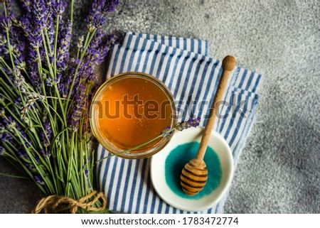 Similar – Image, Stock Photo Honey in glass with honeycomb and blossoms