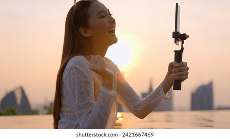 summer leisure casual asia female woman yellow bikini enjoy video calling conversation to her friend via smartphone asian influencer broadcast lifestyle share experience with her follower on social - Powered by Shutterstock