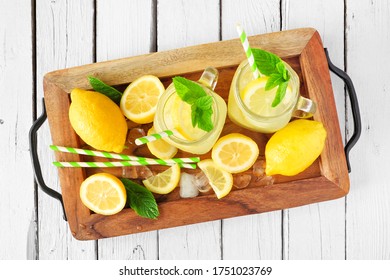 Summer Lemonade Overhead View In A Wooden Serving Tray Against A White Wood Background