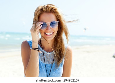 Summer Lifestyle Happy Smiling Portrait Of Pretty Young Woman Blonde Fashion Having Fun On The Beach On Tropic Island In Sunglasses 