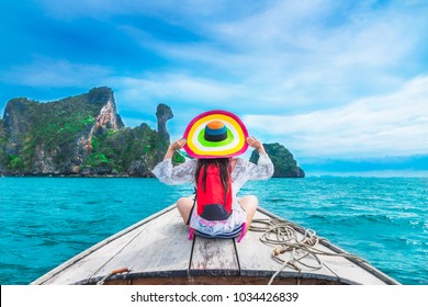 Summer lifestyle traveler woman in bikini and big hat joy relaxing on boat, Kai island, Andaman sea, Krabi, Travel Thailand, Beautiful destination landscape Asia, Summer holiday outdoor vacation trip