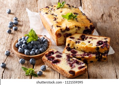 Summer Loaf Of Fresh Blueberry Muffin Bread Cake Decorated With Mint Closeup On A Table. Horizontal
