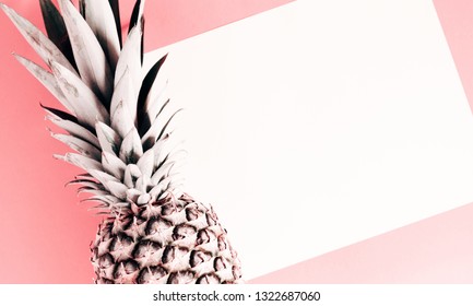 Summer minimal composition. Creative layout made of pineapple on pastel pink background. Flat lay, top view, copy space
