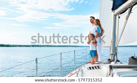 Summer Moments. Family Standing On Yacht Deck Sailing Across The Sea Outside. Free Space For Text, Panorama