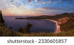 Summer morning Adriatic coastline landscape with Jaz beach (near Budva, Montenegro). Panorama. People are unrecognizable.