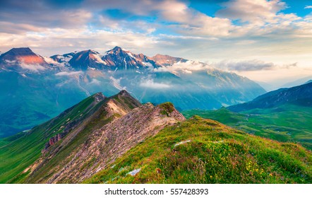 Summer morning view of Grossglockner mountain range from Grossglockner High Alpine Road. Colorful sunrise in Austrian Alps, Zell am See district, state of Salzburg in Austria, Europe.  - Shutterstock ID 557428393