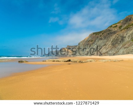 Similar – Aerial Drone View Of Blue Ocean Waves And Beautiful Sandy Beach Shore in Portugal