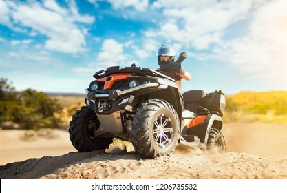 Summer offroad adventure on atv in sand quarry