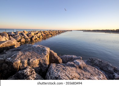 Summer On The Great Lakes Shore. Coastal Great Lakes harbor bathed in the golden glow of the warm summer sun. Tierney Park. Lexington, Michigan. - Shutterstock ID 355683494