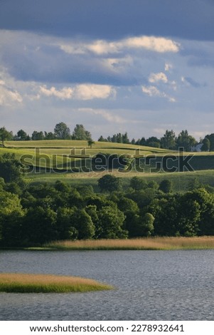 Summer on Kashubia: Beautiful pastoral landscape over the lake Klodno, Poland Stock fotó © 