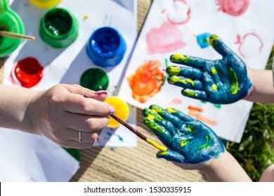 Summer. Open space.  Hands painted with colored paint. Body paint. - Powered by Shutterstock