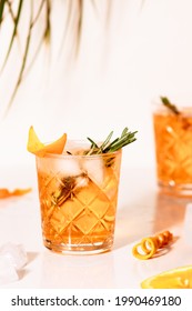 Summer orange cocktail with soda, orange zest adn rosemary