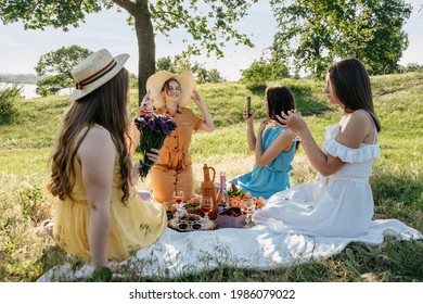 Summer Outdoor Party Ideas. Safe And Festive Ways To Host Small, Outdoor Gathering With Friends. People Safely Get Together. Young Women Girl Friends Talking, Laughing, Having Fun Together At Picnic