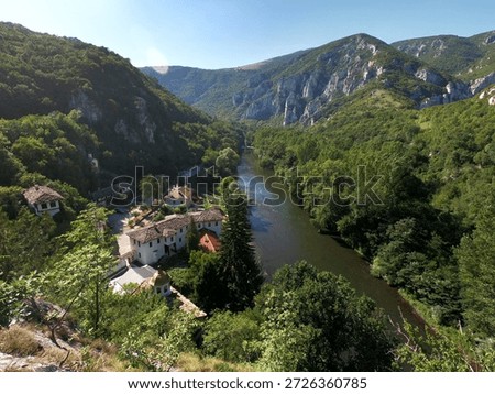 Summer panoramic view of Cherepish Monastery “Assumption of Mary” in Bulgaria, nestled in the Iskar Gorge beneath the Vratsa Balkan, surrounded by dramatic cliffs and river scenery, BG, 02 Aug. 2020
