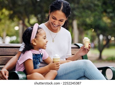 Summer, park and ice cream with a mother and daughter bonding together while sitting on a bench outdoor in nature. Black family, children and garden with a woman and girl enjoying a sweet snack - Powered by Shutterstock