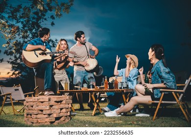 summer party camping of friends group with guitar music, happy young woman and smiling man having fun in vacation holiday, nature outdoors travel of friendship lifestyle together, bar-b-q party time - Powered by Shutterstock