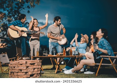 summer party camping of friends group with guitar music, happy young woman and smiling man having fun in vacation holiday, nature outdoors travel of friendship lifestyle together, bar-b-q party time - Powered by Shutterstock