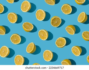 Summer pattern made with fresh yellow lemon slice on bright light blue background. Minimal background summer concept on bright sunlight with sharp shadows - Shutterstock ID 2234669717