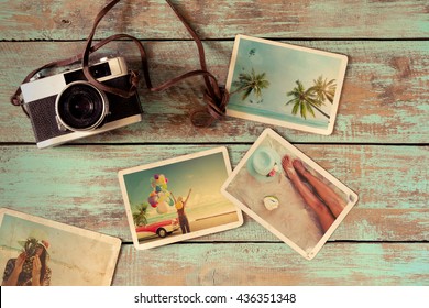 Summer Photo Album Remembrance And Nostalgia Of Journey Honeymoon Trip On Wood Table. Instant Photo Of Vintage Camera - Vintage And Retro Style