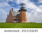 Summer photo of the Block Island RI Southeast lighthouse located on Mohegan Bluffs. New Shoreham, Block Island, Rhode Island.	